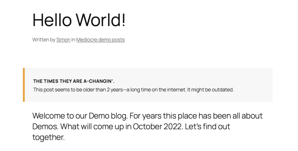 Screenshot of a Hello World blog post. Below the title and above the main content, a box is displayed with the heading "Times there are a-changing," indicating that the sample post appears to be more than 2 years old.
