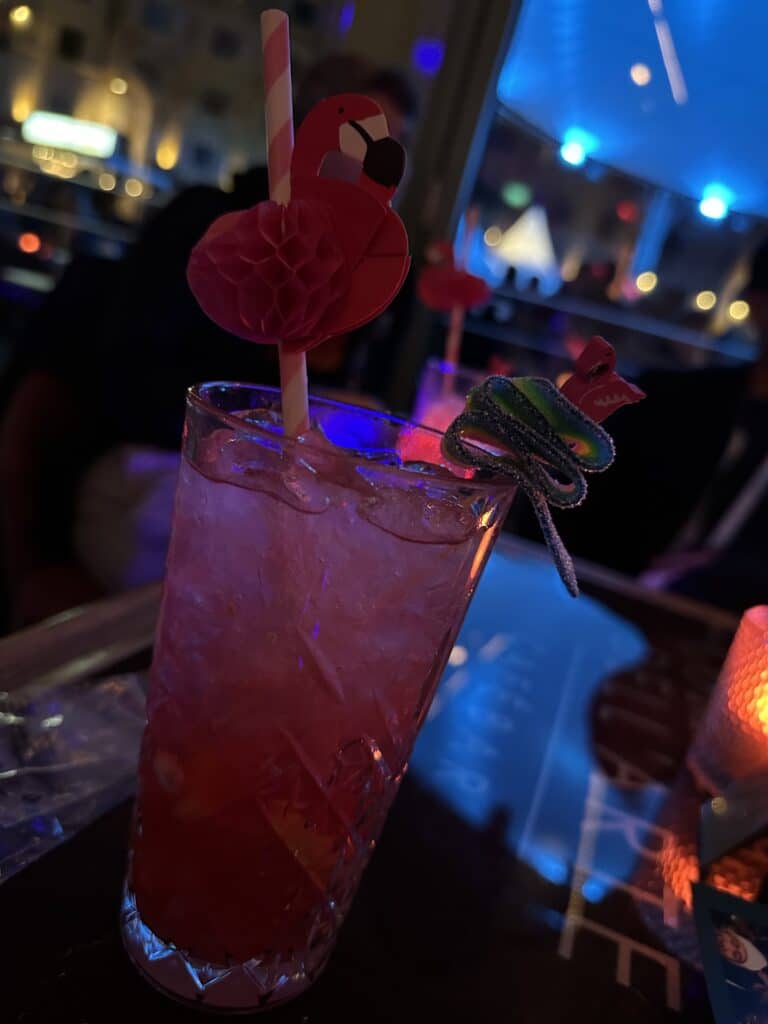 A pink cocktail in a Longdrink glass.